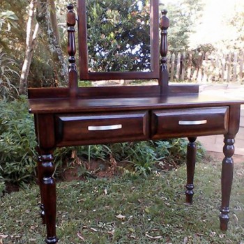 More ornate dark stained dressing table with two drawers and mirror